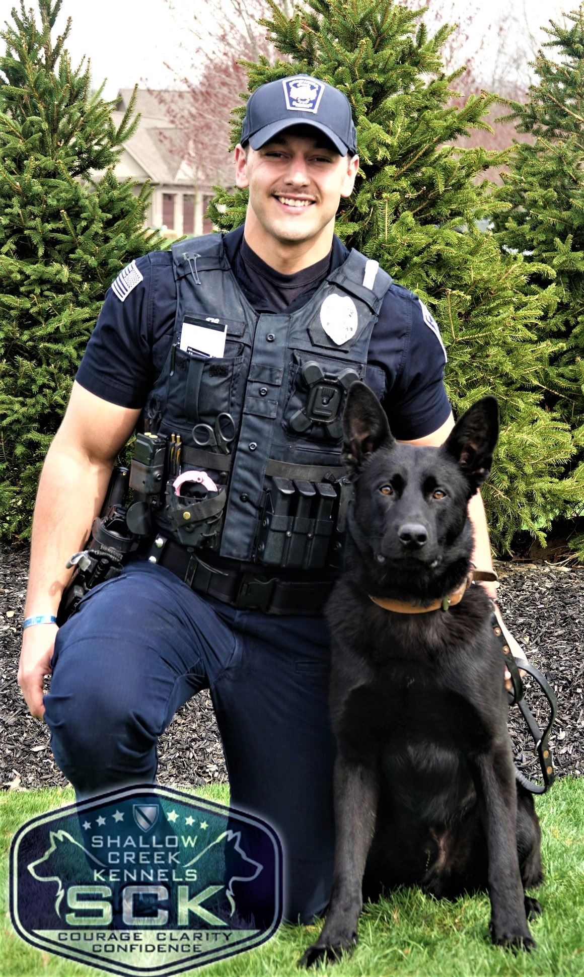 Officer Timothy Ackerman with K9 Draco